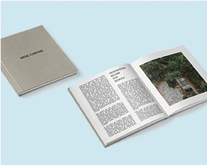 Square photo book opened and closed with linen cover